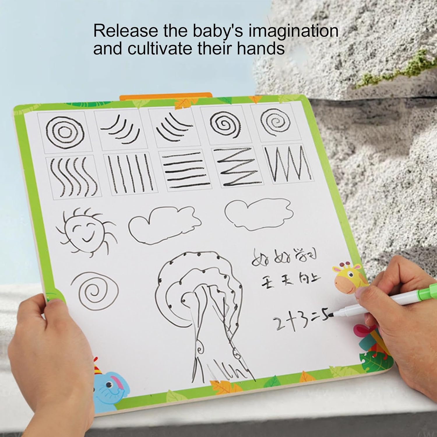 Child drawing on a white board with various shapes and numbers, held by a hand.