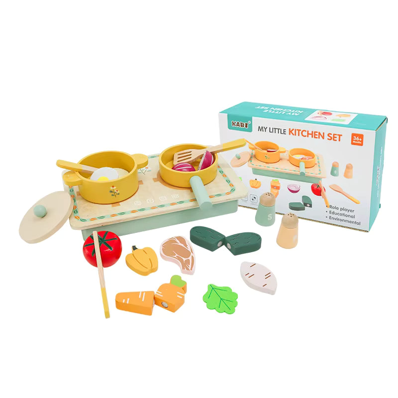 Children's toy kitchen set with various utensils and a Kabi branded box on a white background