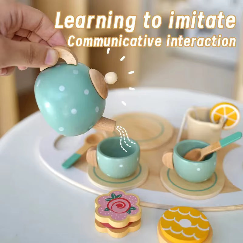 Children's wooden tea set with cups and a teapot on a table, with text about learning to imitate communicative interaction.