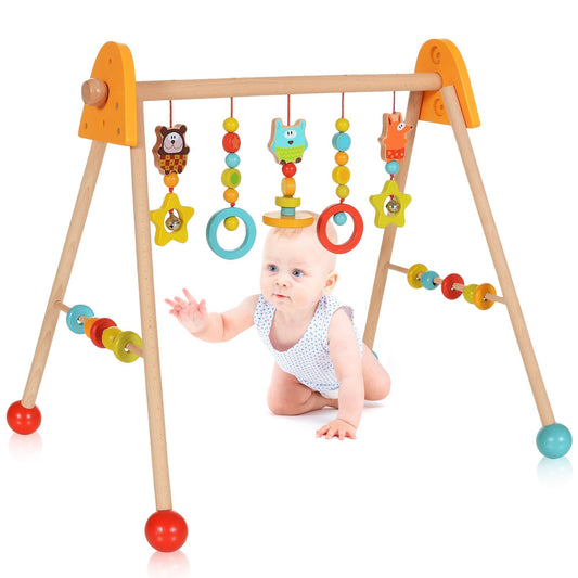 Wooden baby activity gym with hanging sensory toys, rings, beads and Montessori-inspired infant play accessories.